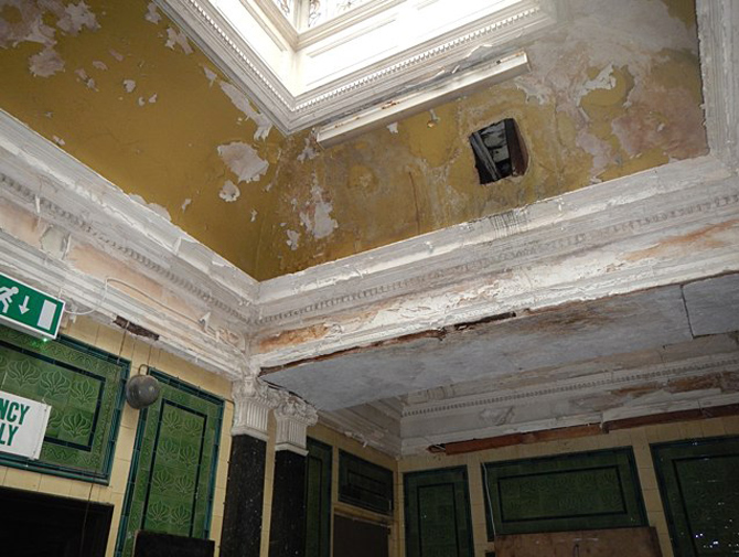 Decorative plaster ceiling in a poor condition due to water damage. Many original features survive from when the building opened in 1880. Image BaRAS