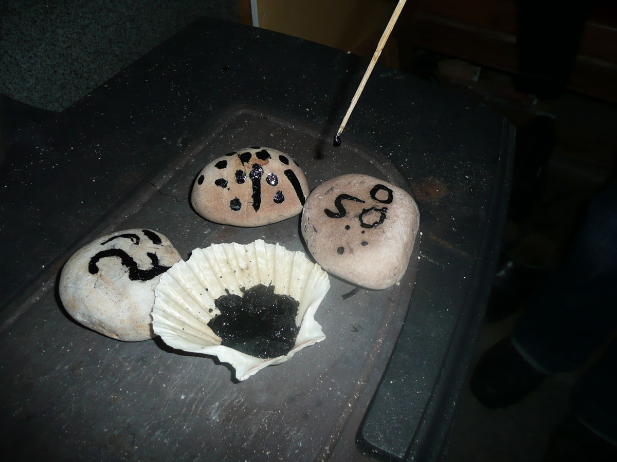 Painting the pebbles using a straw (© Laurie Goodlad).