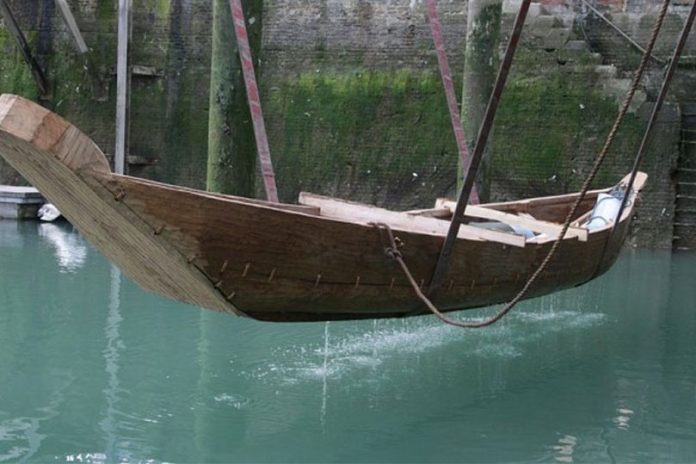 Boat 1550BC is placed into the water at Dover Harbour