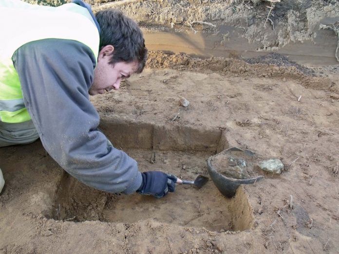 Smelters hoard under excavation. Image: Surrey County Archaeological Unit (SCAU)