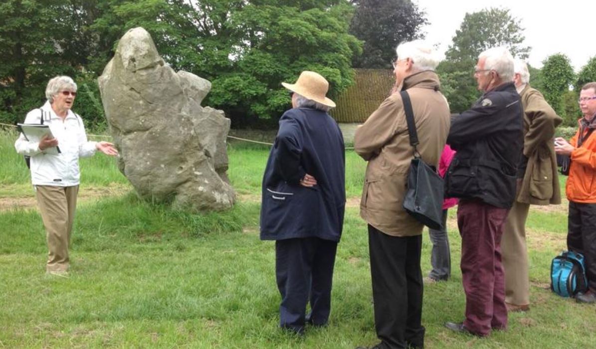 volunteer guides explain the monument: Wessex Archaeology