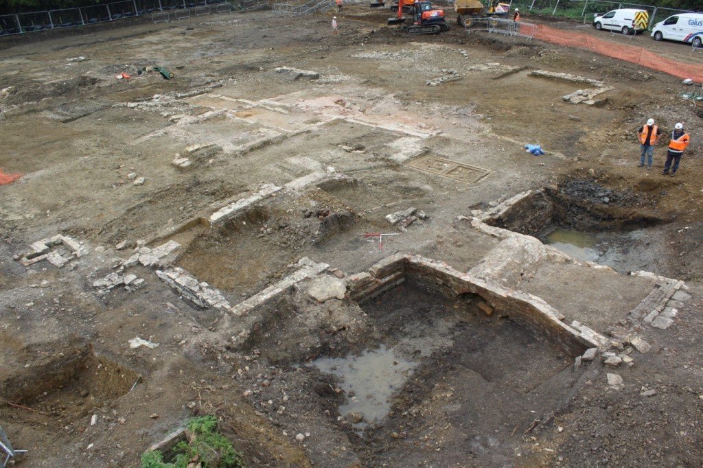 The demolished remnants of the post-medieval domestic buildings within, and contemporary bridge across, the moat