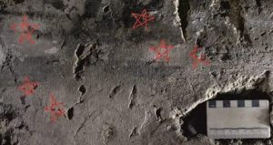 Six tiny pentangles (highlighted in red) incised into the plaster of Dulverton House (photo Urban Archaeology)